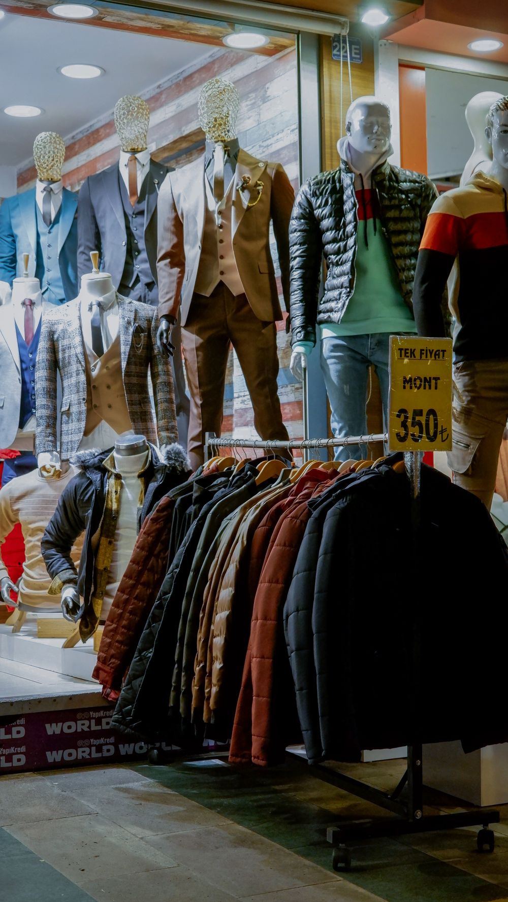 Stylish display of men's suits and jackets in a boutique store, perfect for fashion enthusiasts.